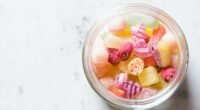 assorted-color candies on container