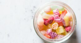 assorted-color candies on container